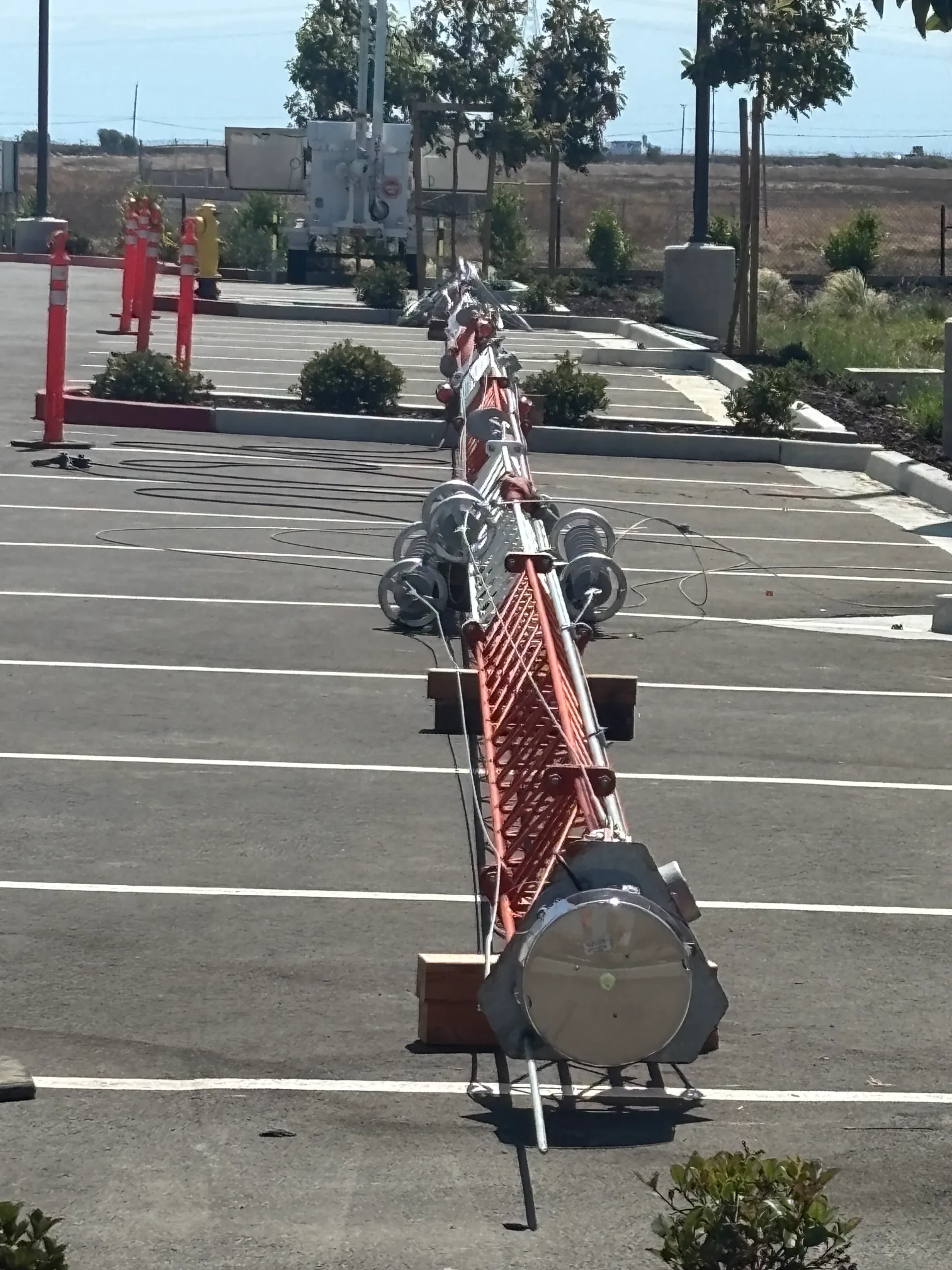 Crew bonding tower sections on the ground prior to installation