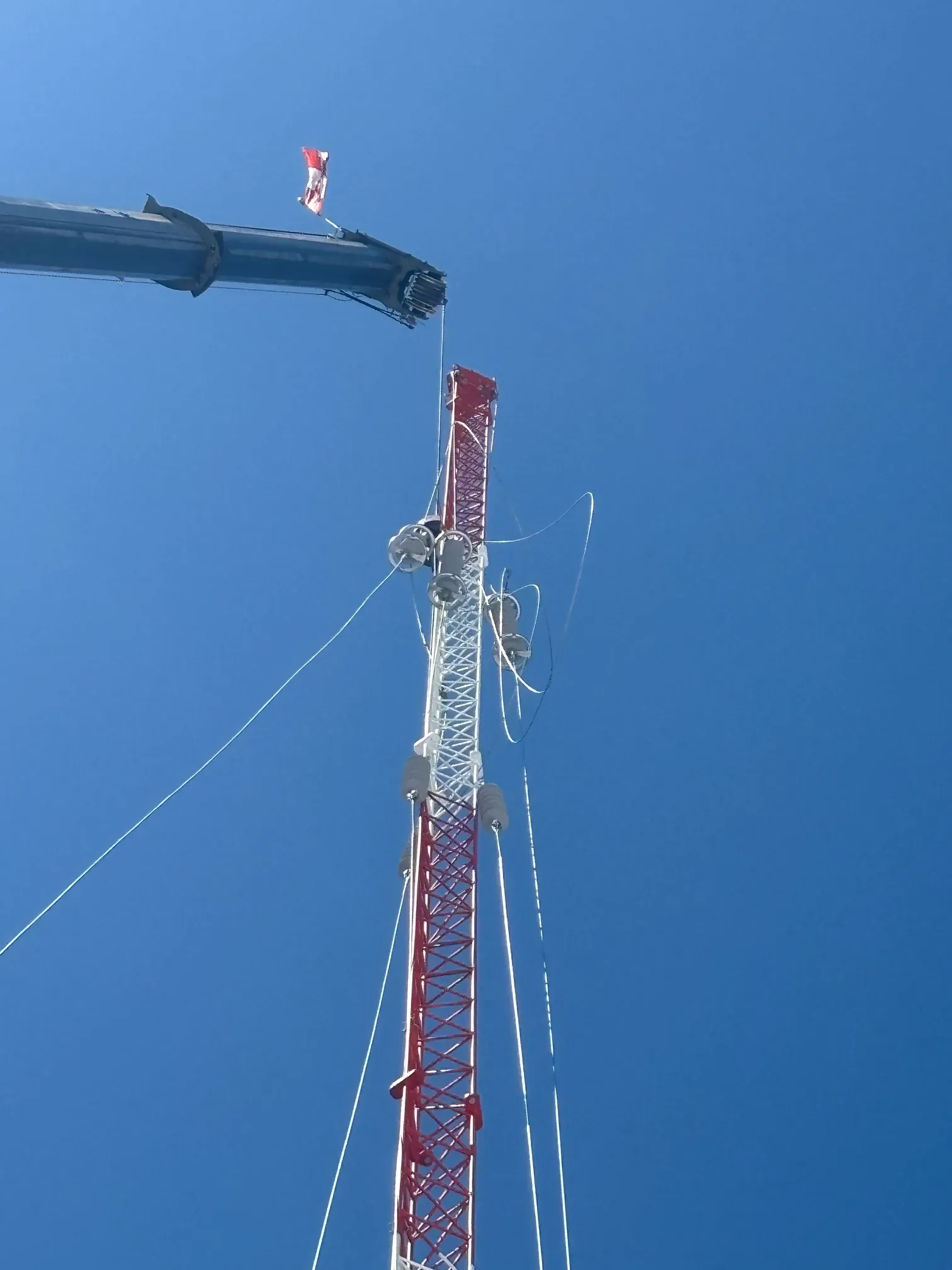 Crane lift of the fully assembled tower onto the roof